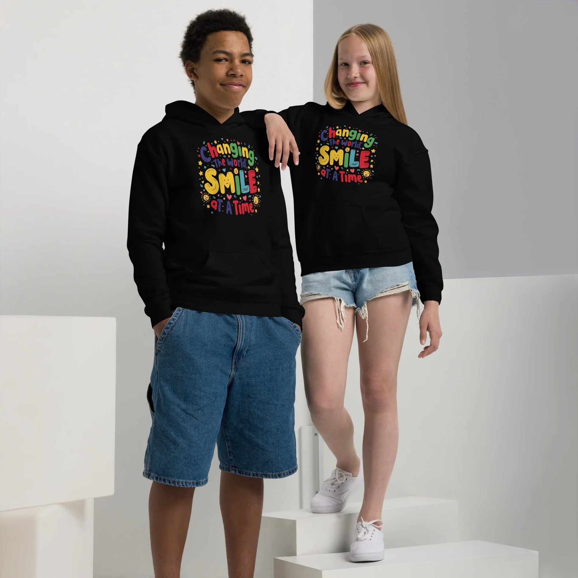Changing The World Smile At A Time | Youth Heavy Blend Hoodie - AwRans Clothing